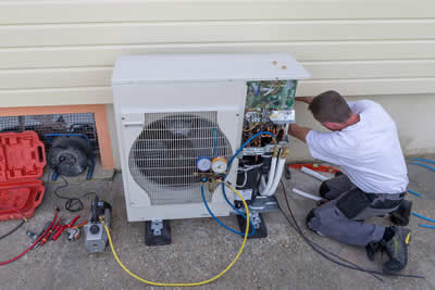 HVAC Technician working on a ductless system.